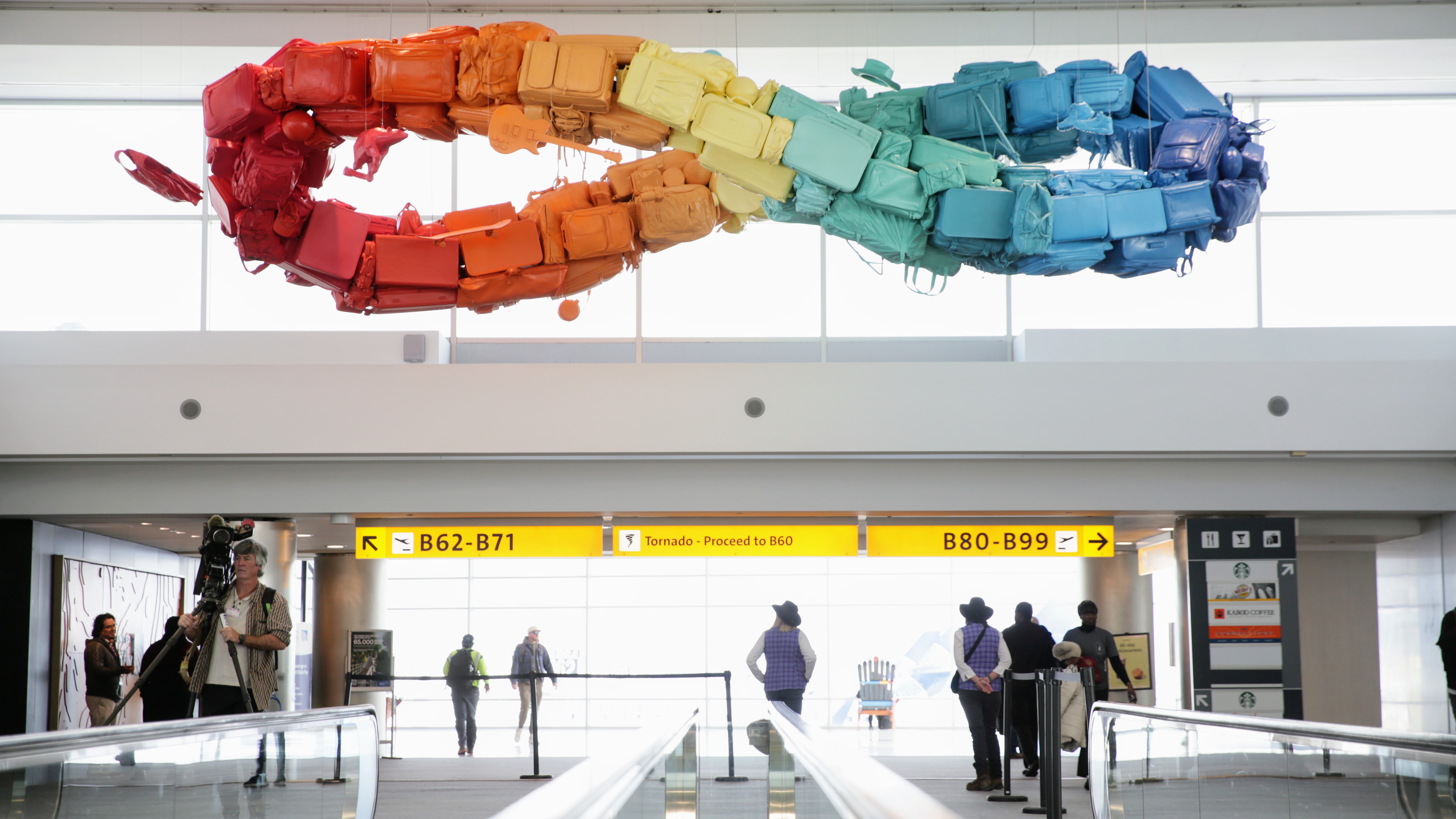 Detour’s upcycled luggage sculpture is finally up at Denver ...