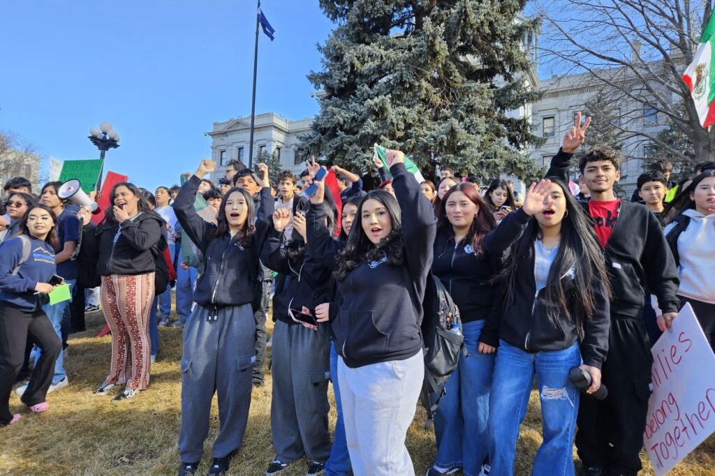 Student ICE protestors hold up Mexican flags in front of Colorado Capitol